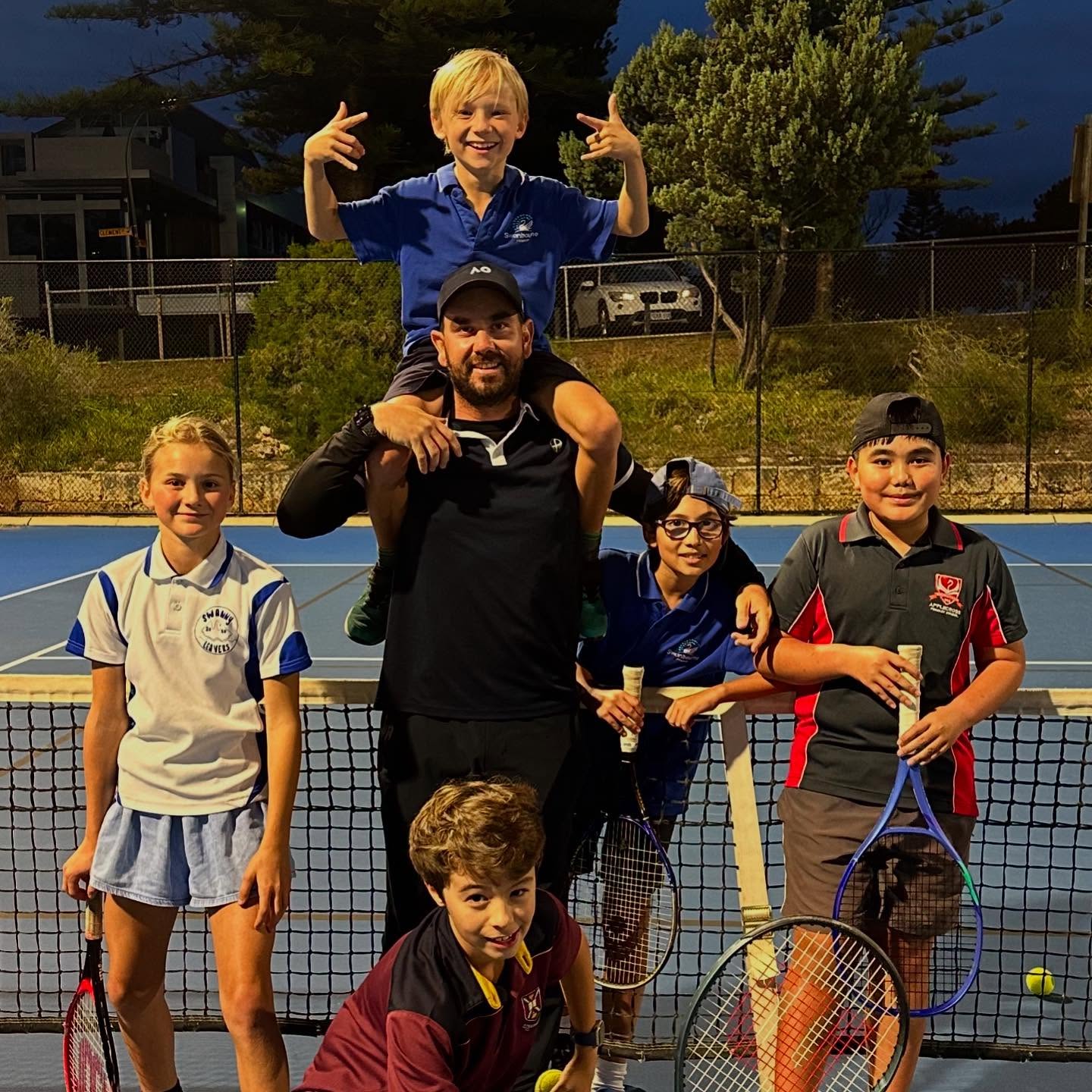 A Prime Tennis coach running a junior lesson at Allen Park
