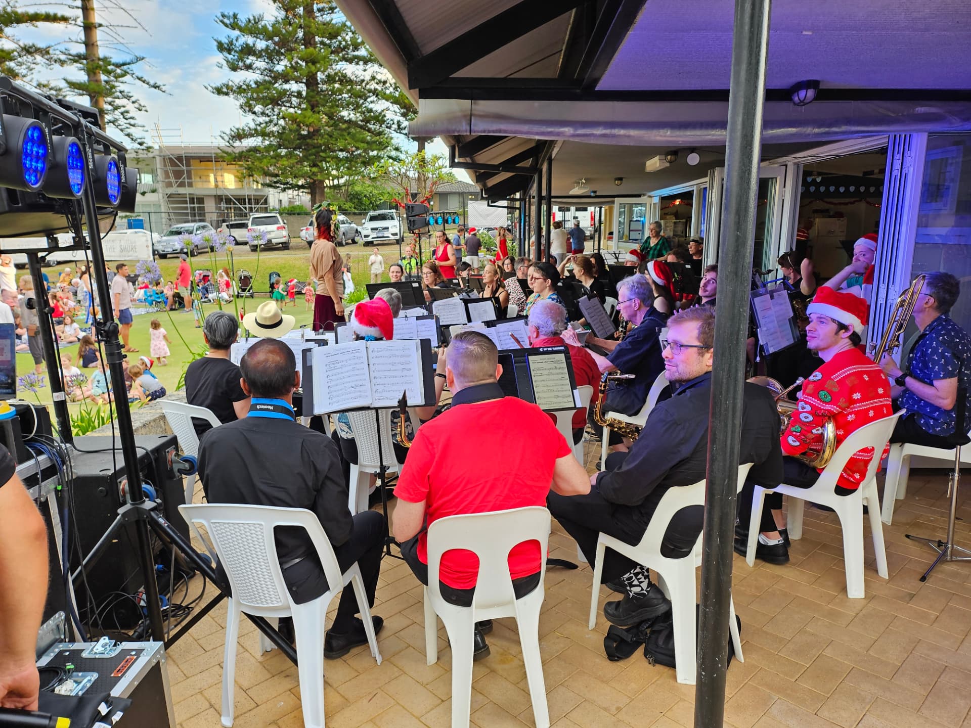 The concert band performing Christmas music on the clubhouse verandah
