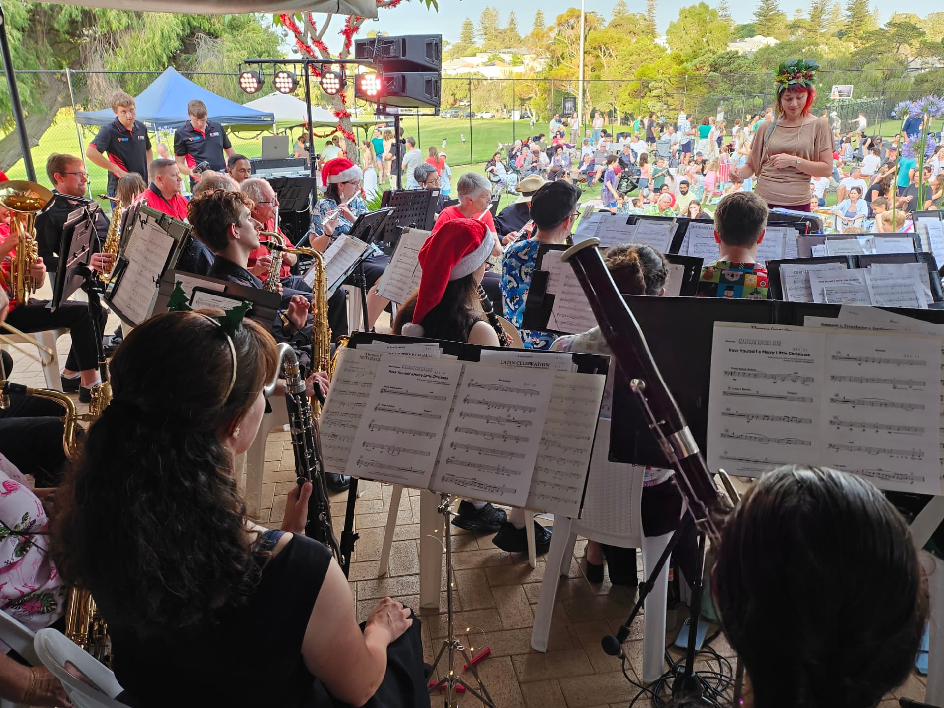 Musicians playing carols to the crowd at Allen Park