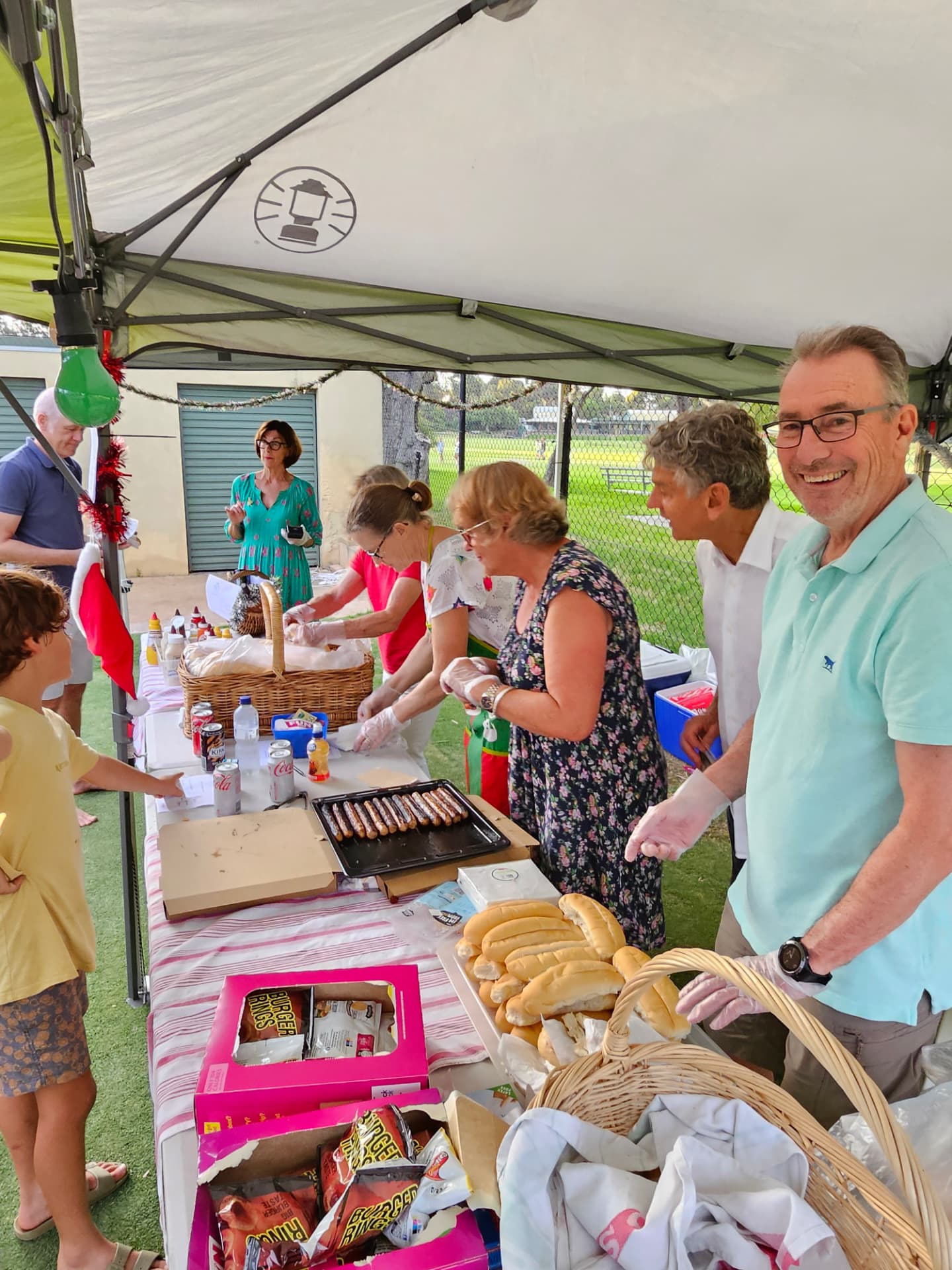 Volunteers serving food from the club's marquee