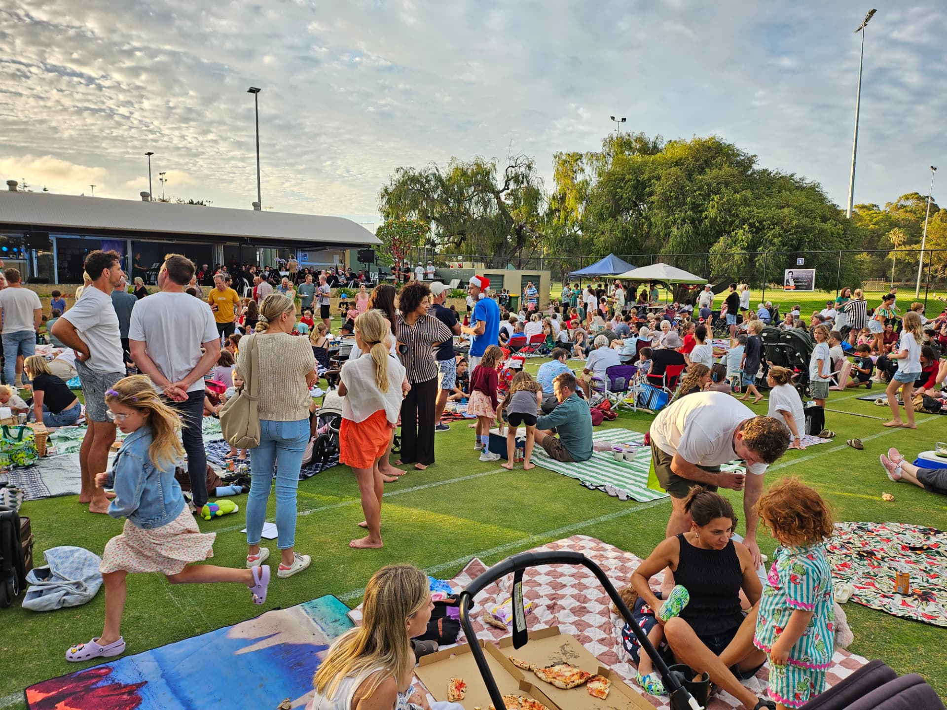 Children and families enjoying the festive evening at Allen Park